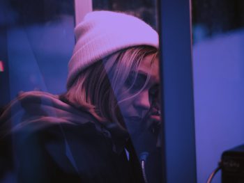Photo of woman in phone booth